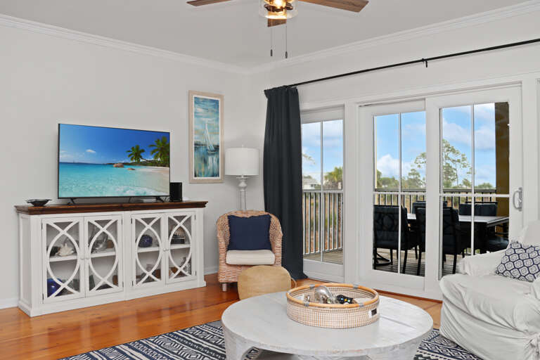 Living Room with TV and DEck Living Room with TV and DEck