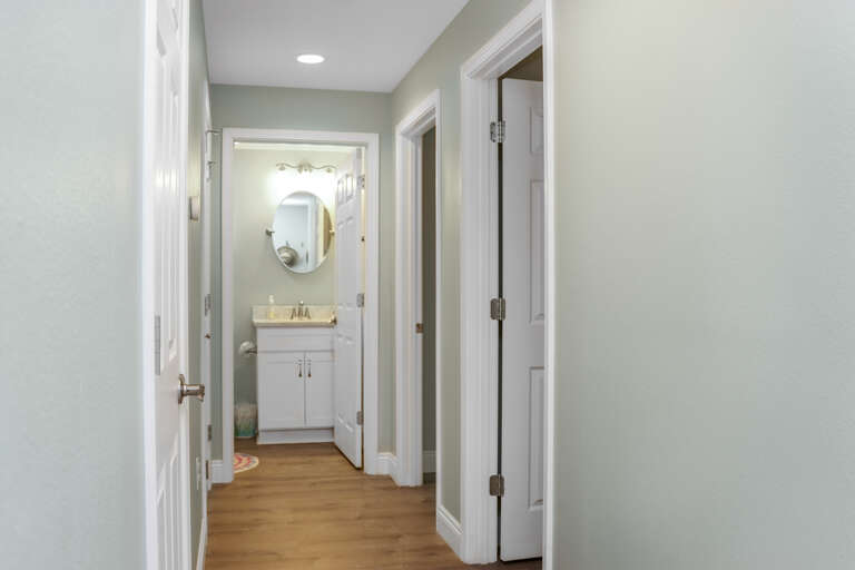 Hallway with Full Bath and Two Bedrooms