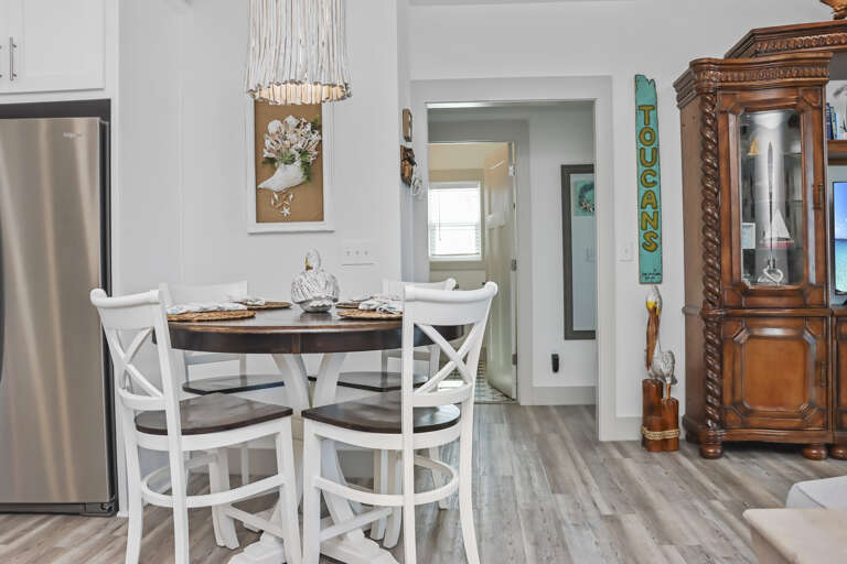 Dining Area and Full Bathroom in Background
