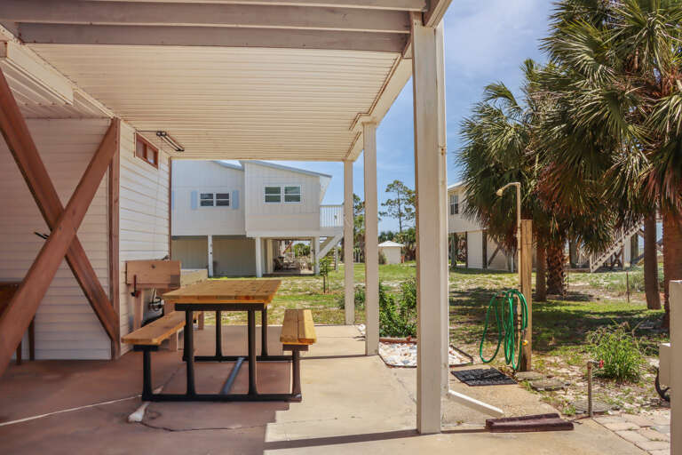 Outdoor Dining and Fish Cleaning Area Under House