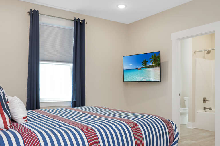 Bedroom 2 with TV and Master Bathroom