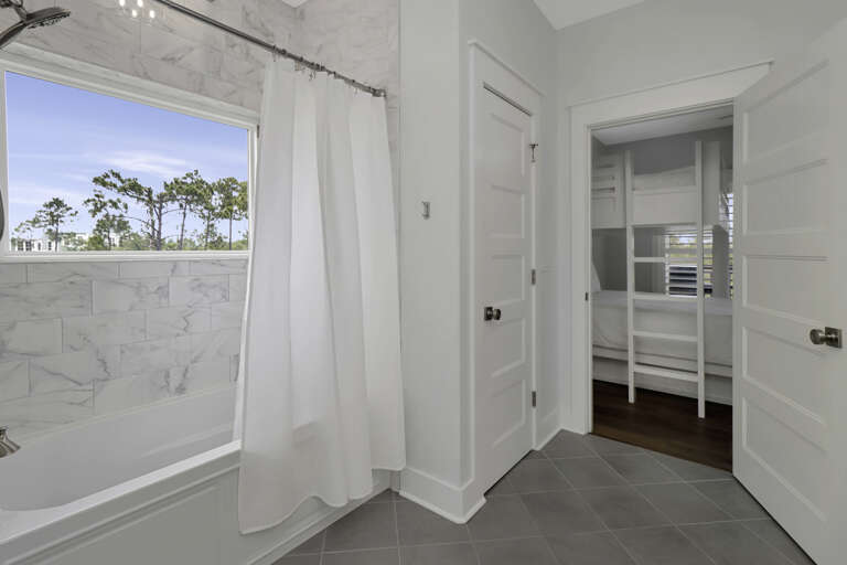 Jack and Jill Bathroom with Combination Tub and Shower