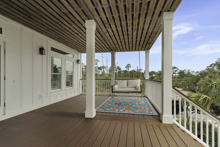 Covered Front Deck on First Floor with Swing
