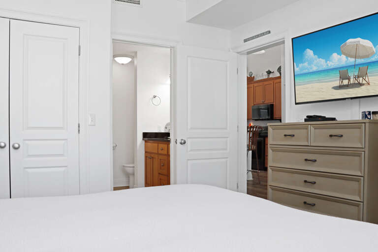 Bedroom 2 with TV and Master Bathroom