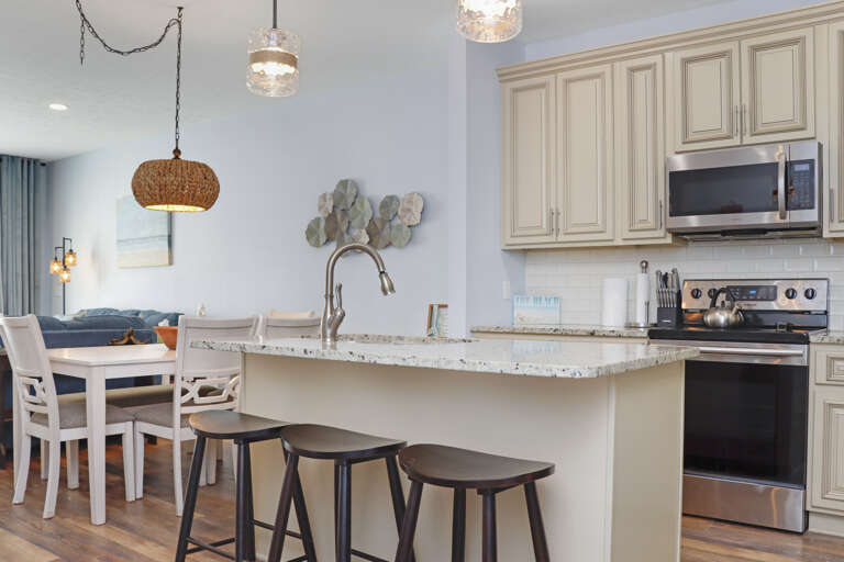 Kitchen with Bar Seating and Dining Area