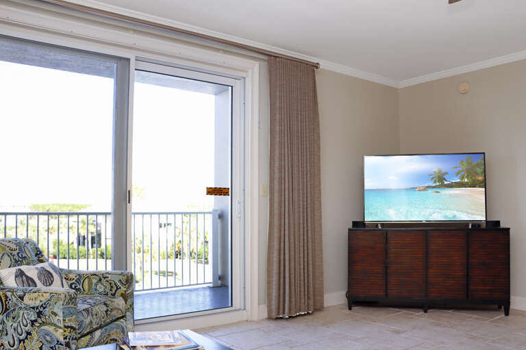 Living Room with TV and Canal Front Balcony