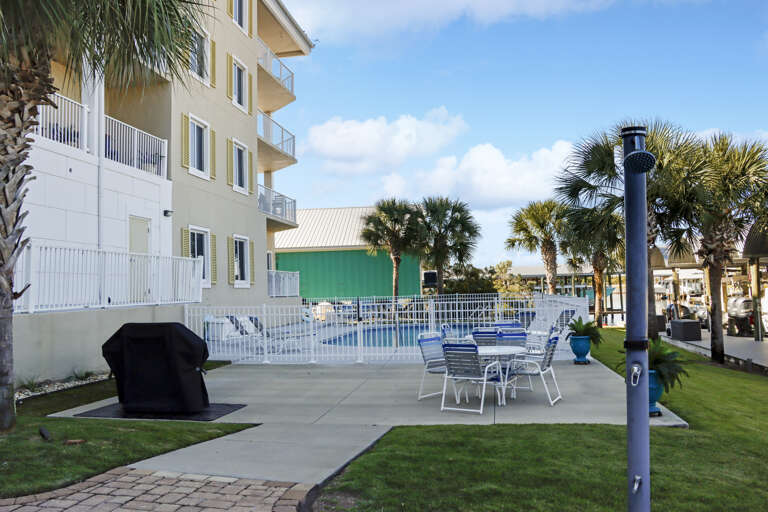 Outdoor Grilling and Dining Space Next to Pool