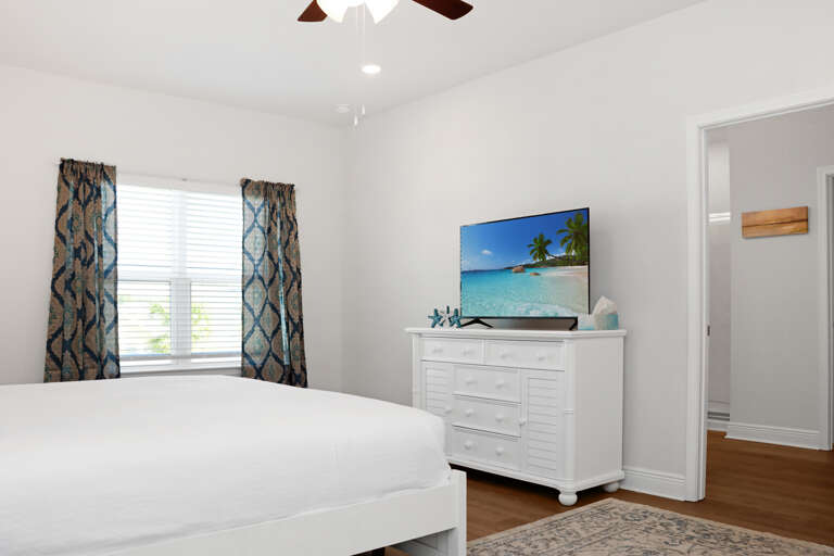 Bedroom 2 with TV and Master Bathroom