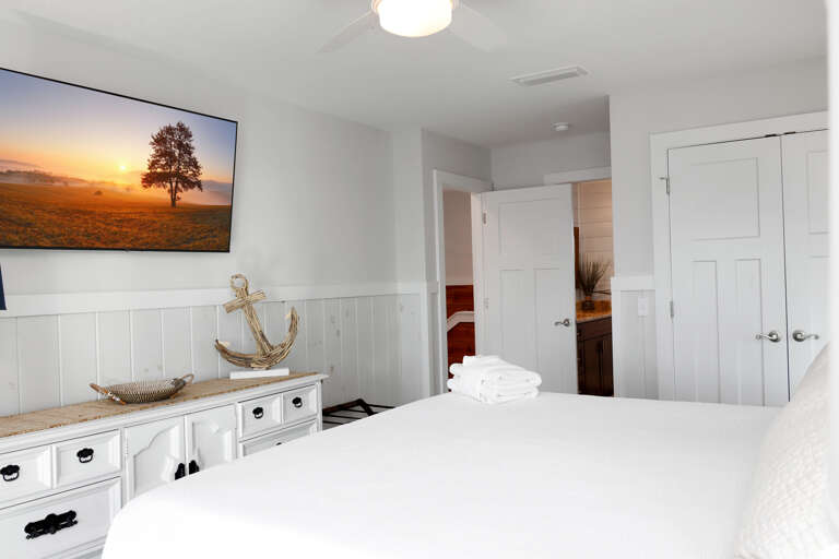 Bedroom 2 with TV and Master Bathroom