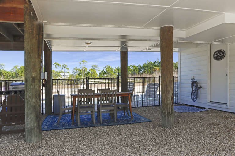 Outdoor Dining Under House and Laundry Room