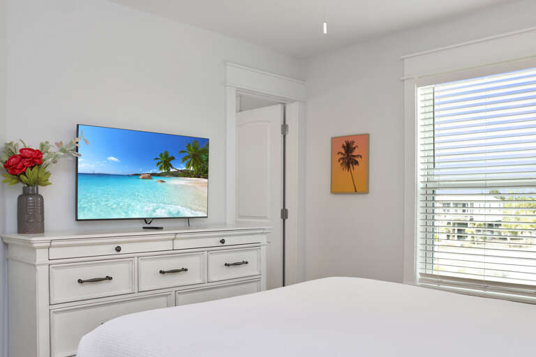 Bedroom 2 with TV and Master Bathroom