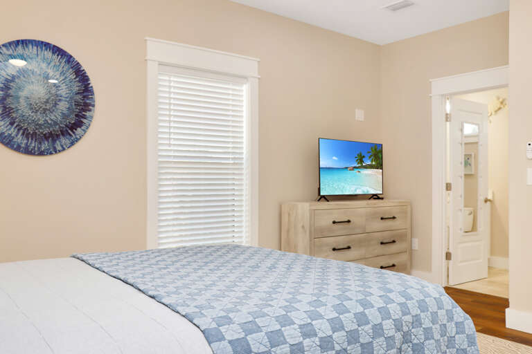 Bedroom 2 with TV and Master Bathroom