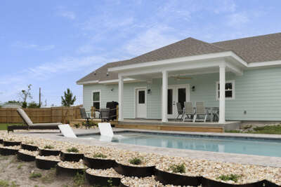 Swimming Pool with Overlooking Back Porch