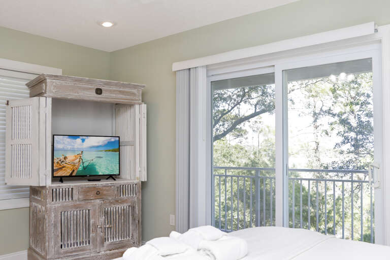 Bedroom 4 with TV and Bay Front Deck