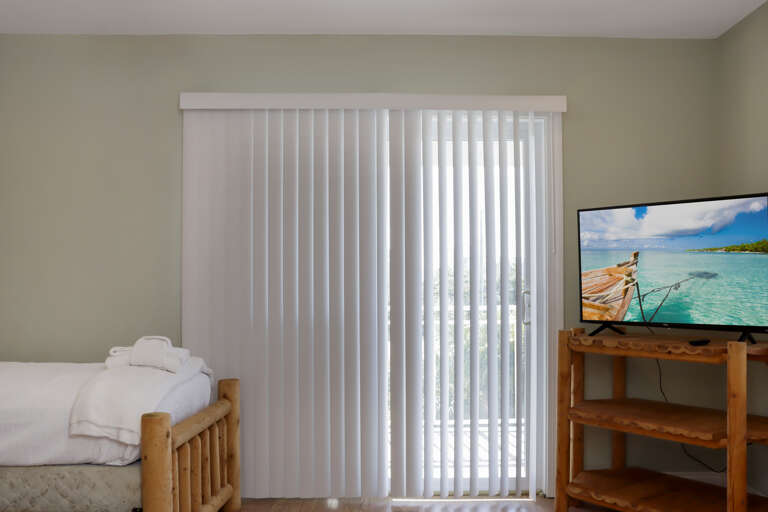 Bedroom 3 with Beach View Deck and TV