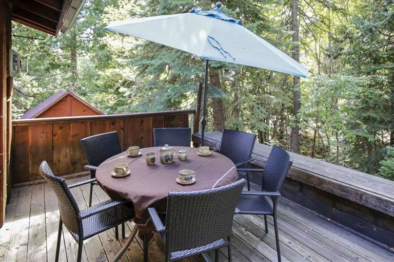 Outdoor deck table and umbrella