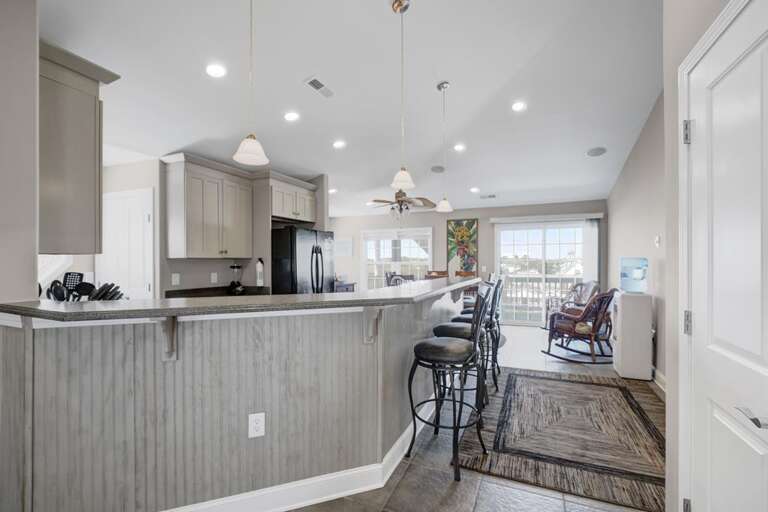 TO KITCHEN AND DINING SPACES TO KITCHEN AND DINING SPACES