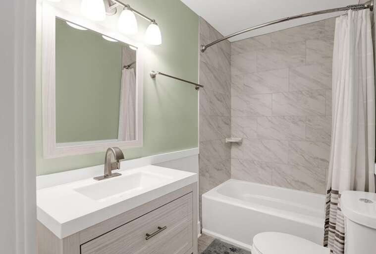 UPDATED MAIN BATH WITH TUB SHOWER COMBO