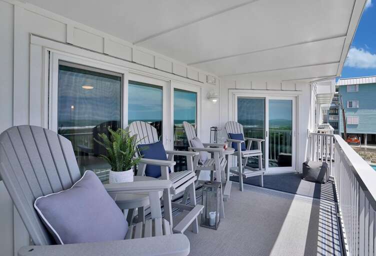 COVERED DECK WITH PLENTY OF SEATING