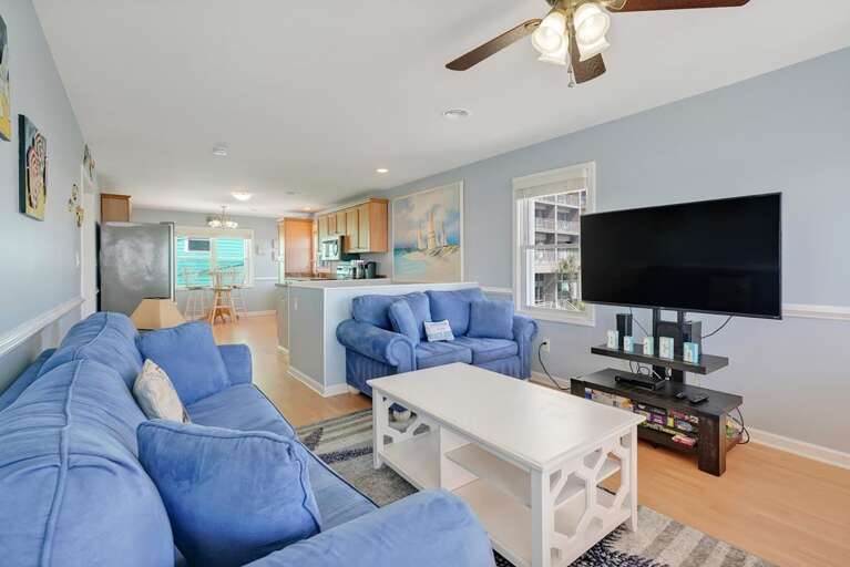 LIVING SPACE WITH LARGE FLAT SCREEN TV