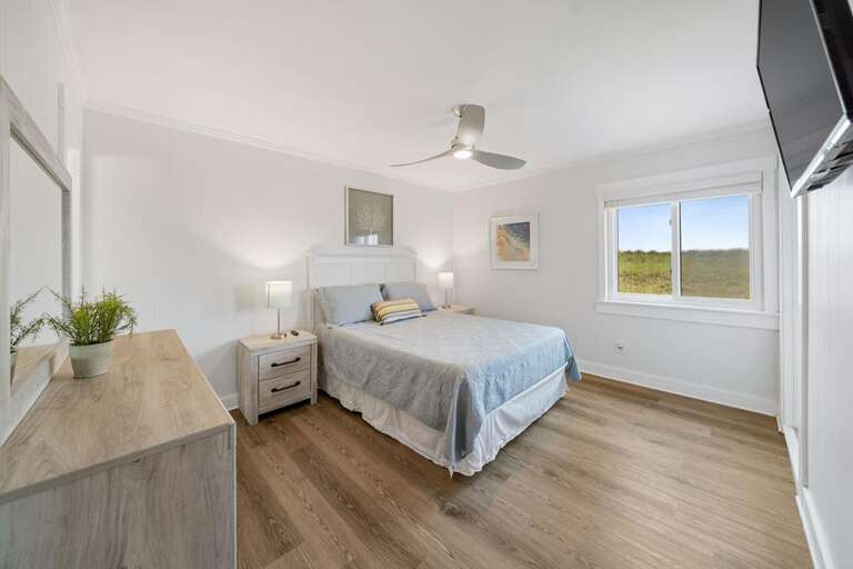 MAIN QUEEN BEDROOM WITH HALF BATHROOM