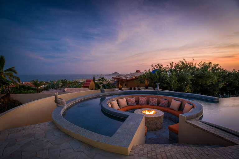 Sunset View From Circular Poolside Seating Area In A Vacation Rental