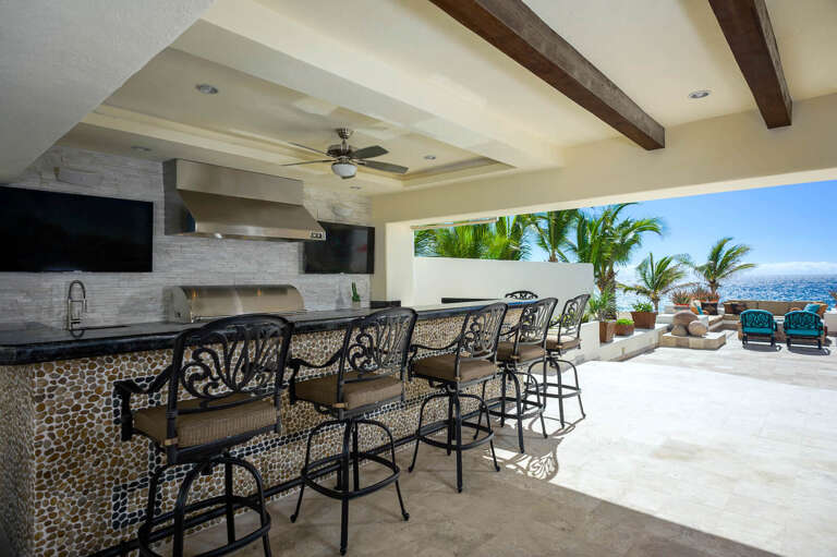Relax by the stunning bar under the covered patio that features not one, but 2 large flatscreen TVs! Relax by the stunning bar under the covered patio that features not one, but 2 large flatscreen TVs!