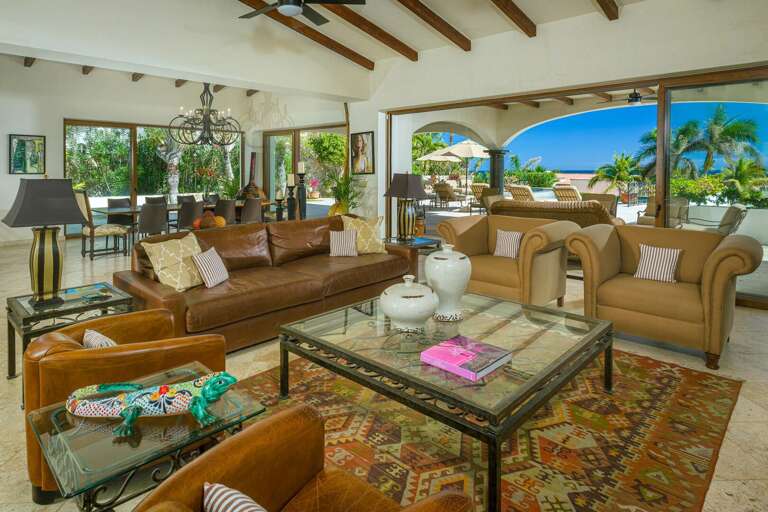 Gather together on plush cushions in the open-concept living and dining area of Casa Maravilla! Gather together on plush cushions in the open-concept living and dining area of Casa Maravilla!