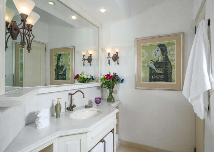 Fine art flows throughout the walls of this home, including in the bathrooms