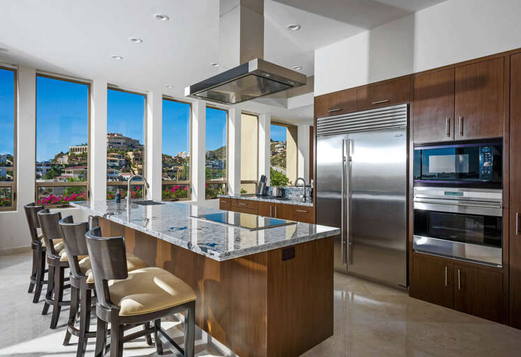 Take advantage of all the modern appliances found in the spacious gourmet kitchen in Villa Pacific West