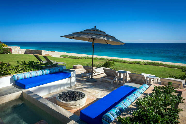 With enough room for everyone, don't miss a chance to gather around on plush cushions by Piedra Blanca's fire pit!