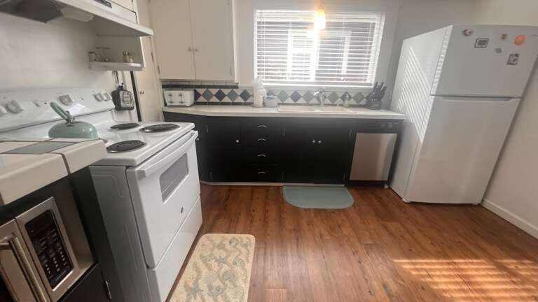 Your fully equipped kitchen features modern appliances and ample counter space for preparing meals during your stay.