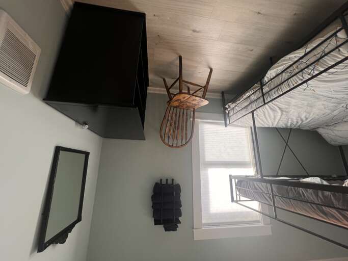 You'll find smart space-saving design in this cozy bedroom with bunk beds, wall-mounted TV, and modern finishes that keep your stay comfortable and organized.