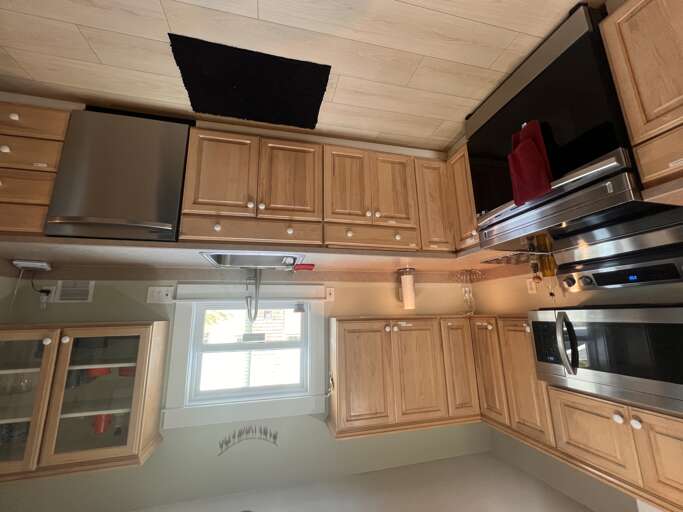 Your fully equipped kitchen features modern stainless steel appliances, ample storage, and warm wood cabinetryâperfect for preparing home-cooked meals during your stay.