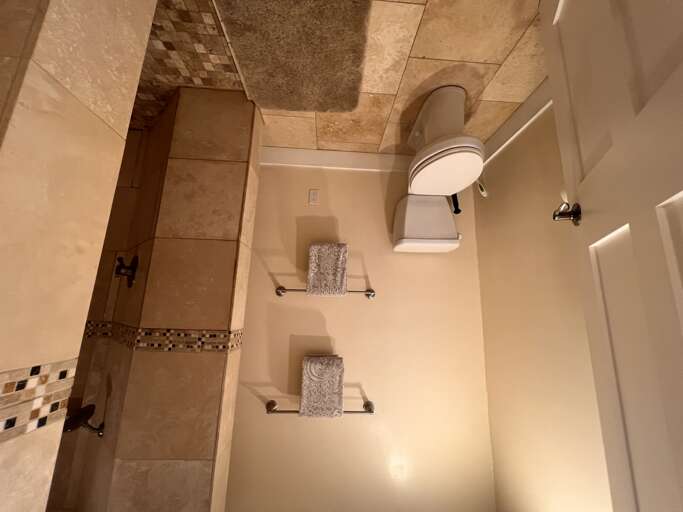 Your private bathroom features elegant tile work, plush towels, and modern fixturesâa serene space to refresh and unwind after a day of exploring.