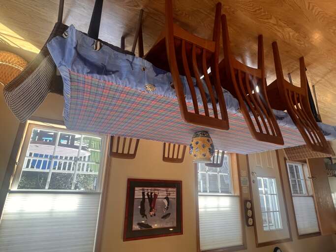 Step up into your own cozy loft with charming wood railings and vaulted ceilings. Natural light pours through the windows while nautical touches add character to your private retreat.