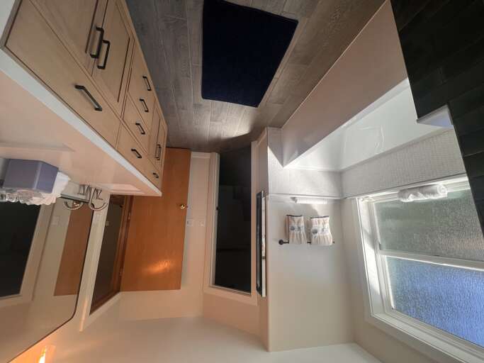 Step into your private spa-like bathroom where natural light spills in, fluffy towels await, and every detail is designed for your comfort and relaxation.
