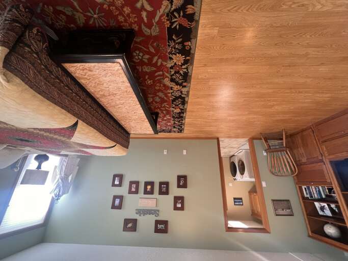 You'll love the warmth of the wood floors and the character of the handcrafted furniture and colorful rugs. Convenient laundry access keeps your stay comfortable and stress-free.