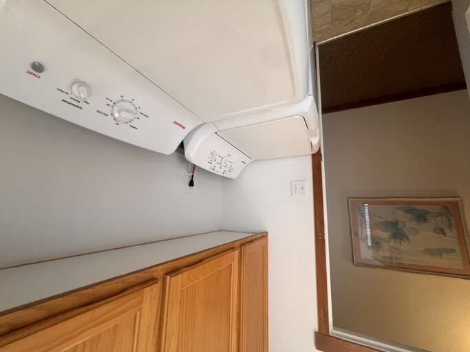 Your personal laundry space features a stacked washer and dryer for ultimate convenience during your stay.