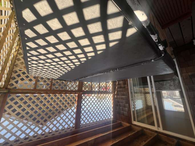 Your private balcony features lattice railings and partial shade, creating cozy spots to relax while enjoying gentle filtered sunlight.