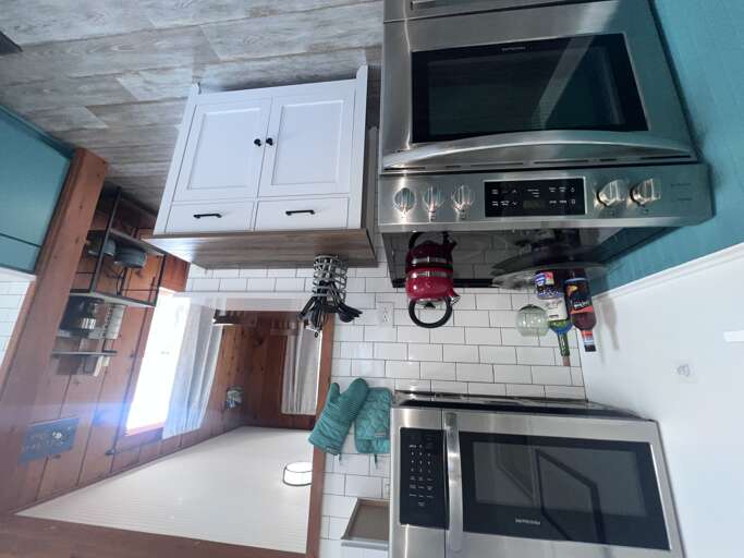 Cook your favorite meals with modern appliances and all the essentials you need, from stainless steel oven to sleek microwave, ready for your culinary adventures.
