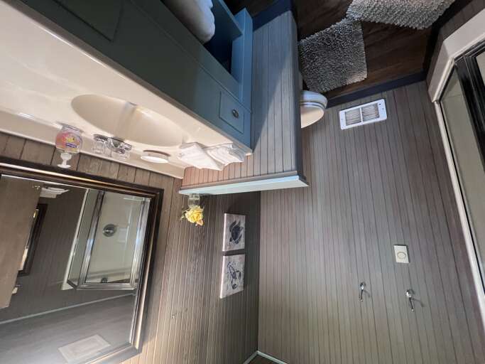 Step into a thoughtfully designed bathroom with soothing coastal tones, soft textured rugs beneath your feet, and everything you need within easy reach for a comfortable stay.