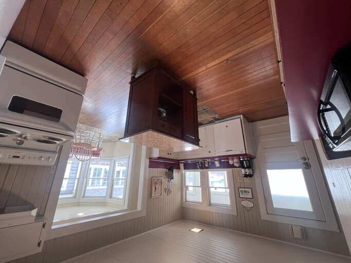 Step into your charming kitchen and plenty of natural light streaming through the windows, perfect for preparing your morning coffee or planning your day's adventures.