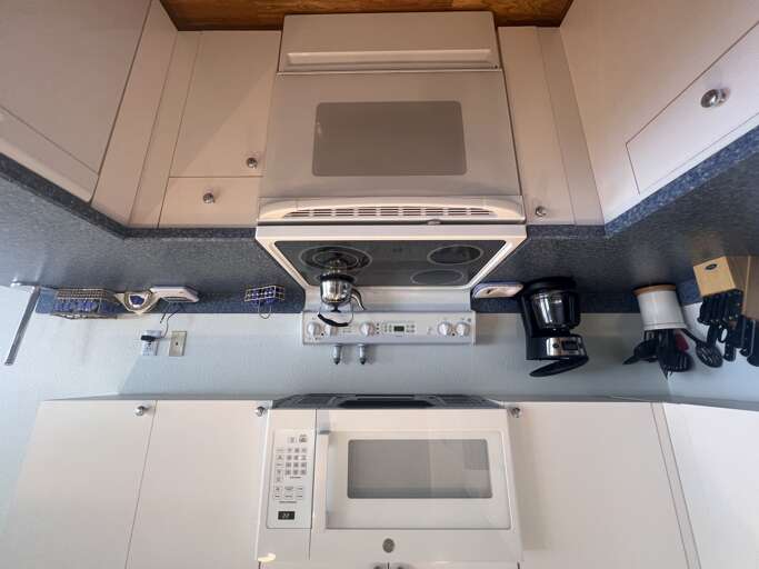 Your fully-equipped kitchen features modern appliances, a built-in microwave, and a gas stove, ready to help you prepare your favorite meals during your stay.