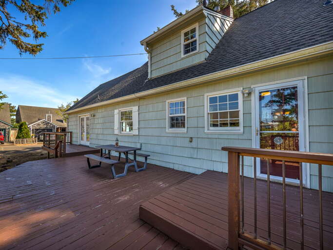 Step onto your spacious private deck with a picnic table, perfect for morning coffee or sunset gatherings. The fresh air and open sky create a peaceful retreat right outside your door.