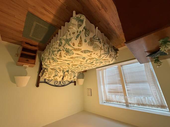 Drift off beneath rich wooden ceilings and charming coastal décor, with natural light pouring through your windows to greet each morning.