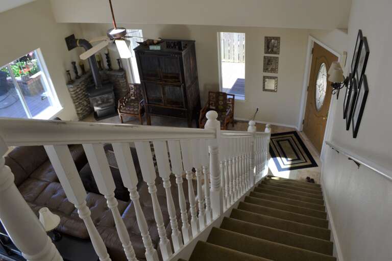 Front door at bottom of steps