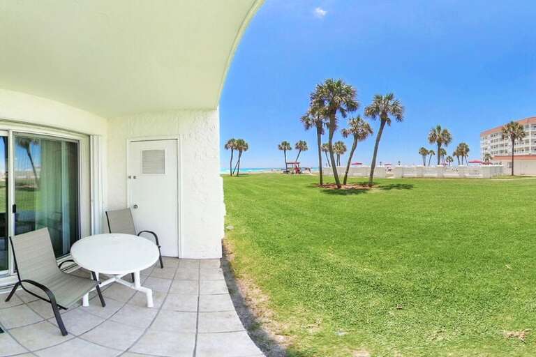 Ground Level patio (left) near beach and pool (right) - El Matador Resort, Okaloosa Island Fort Walton Beach Vacation Rentals