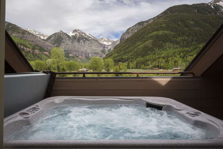 The private hot tub of this Colorado Mountain vacation rental, with views out onto the mountains.