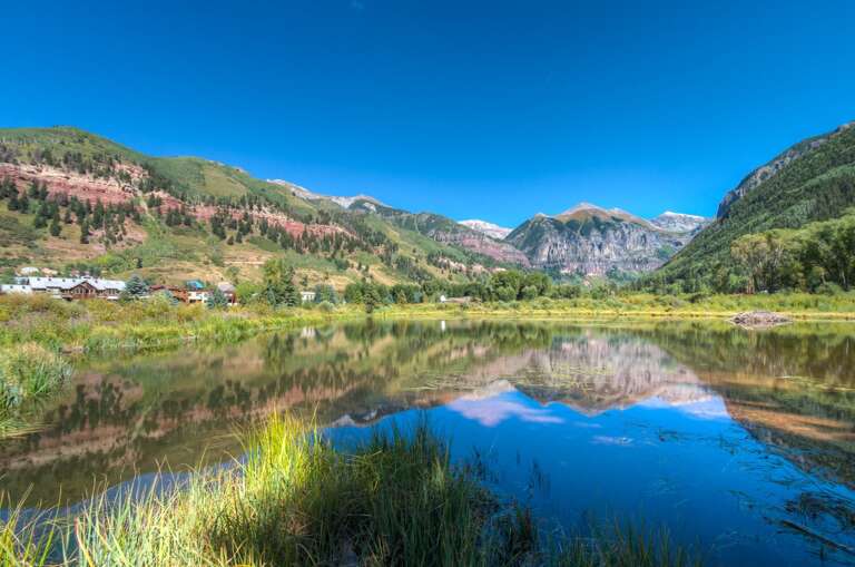 Beaver Pond view of mountain landscape with grass Beaver Pond view of mountain landscape with grass
